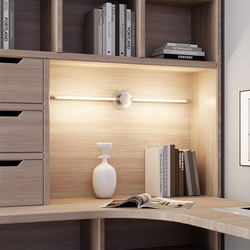 Product Features Modular Transformable Design: The combination of dual light rods and a round base supports multiple installation forms (horizontal straight, vertical long strip), adapting to different spatial layouts. Minimalist Premium Appearance: Matte metal base paired with transparent linear light strips, featuring clean and pure lines, serving as a textured wall art piece even when unlit. Soft Linear Light Source: Uniform long-strip LED light, gentle and non-glaring, flicker-free and blue-light hazard-free, protecting eyes while creating a warm atmosphere. Multi-Scene Adaptability: Suitable for installation on bedside, hallway, living room background wall, hallway, etc., balancing practicality and decorativeness. Sturdy and Durable Structure: Metal lamp body and base, with a firm and deformation-resistant structure, wear-resistant and corrosion-resistant surface, maintaining texture after long-term use.